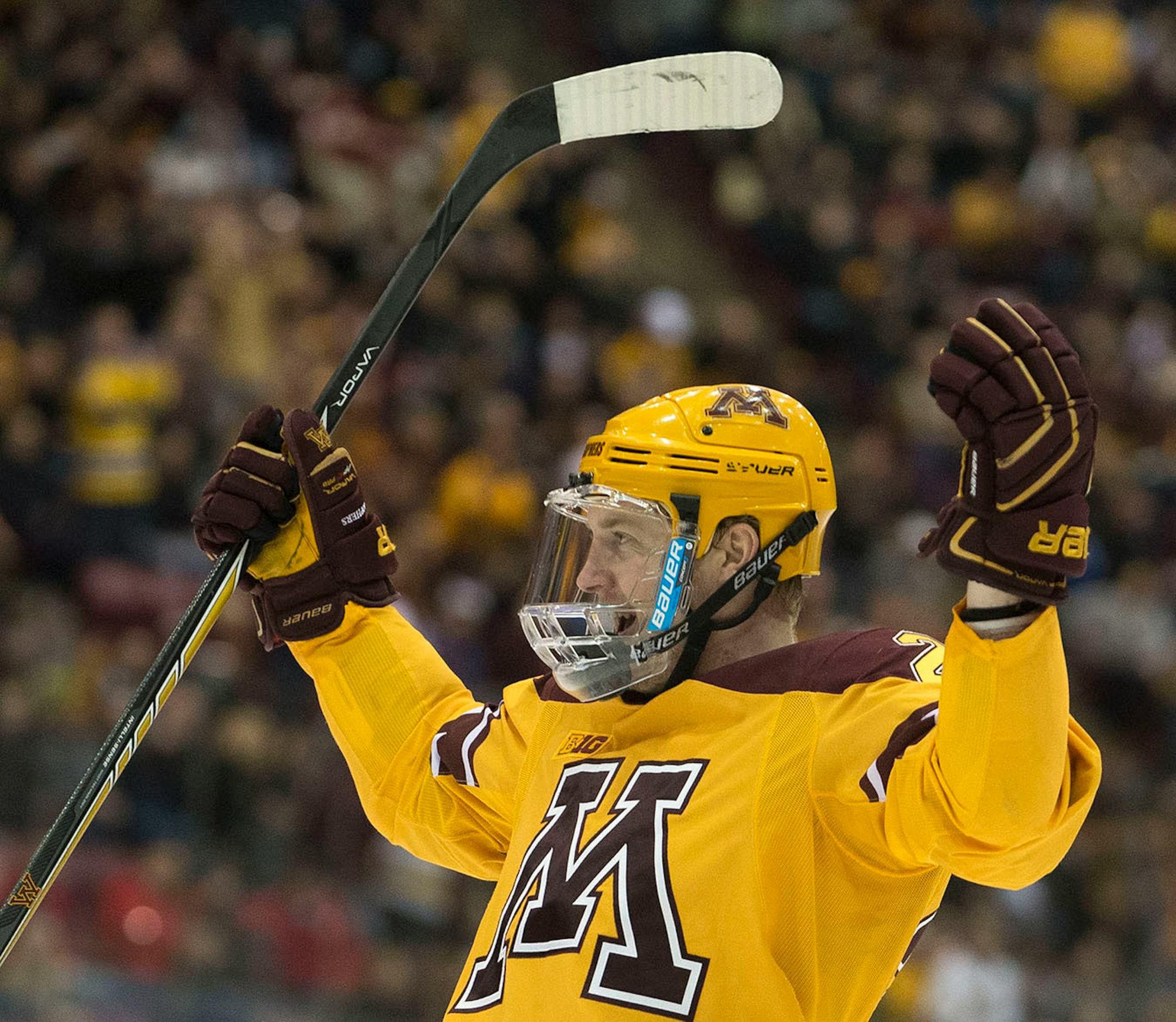 Minnesota center Travis Boyd (22) celebrates a goal scored against Ohio State during the second period. ] (Aaron Lavinsky | StarTribune) University of Minnesota men's hockey takes on Ohio State on Saturday, Feb. 7, 2015 at Mariucci Arena.