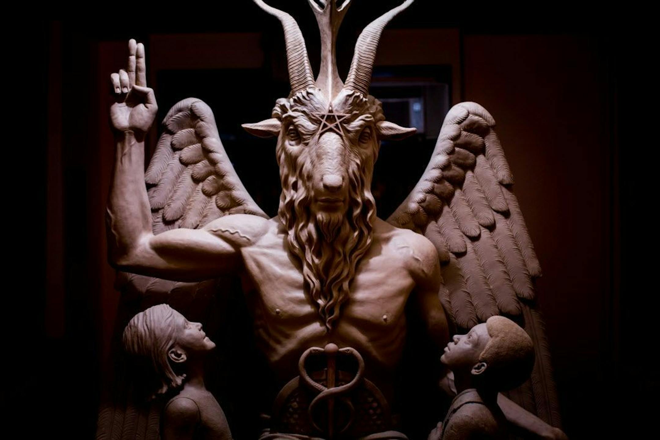 This 2014 photo provided by The Satanic Temple shows a bronze Baphomet, which depicts Satan as a goat-headed figure. The group attempted to have the statue added to state capitol grounds in Oklahoma and Arkansas to counter Ten Commandments monuments.
