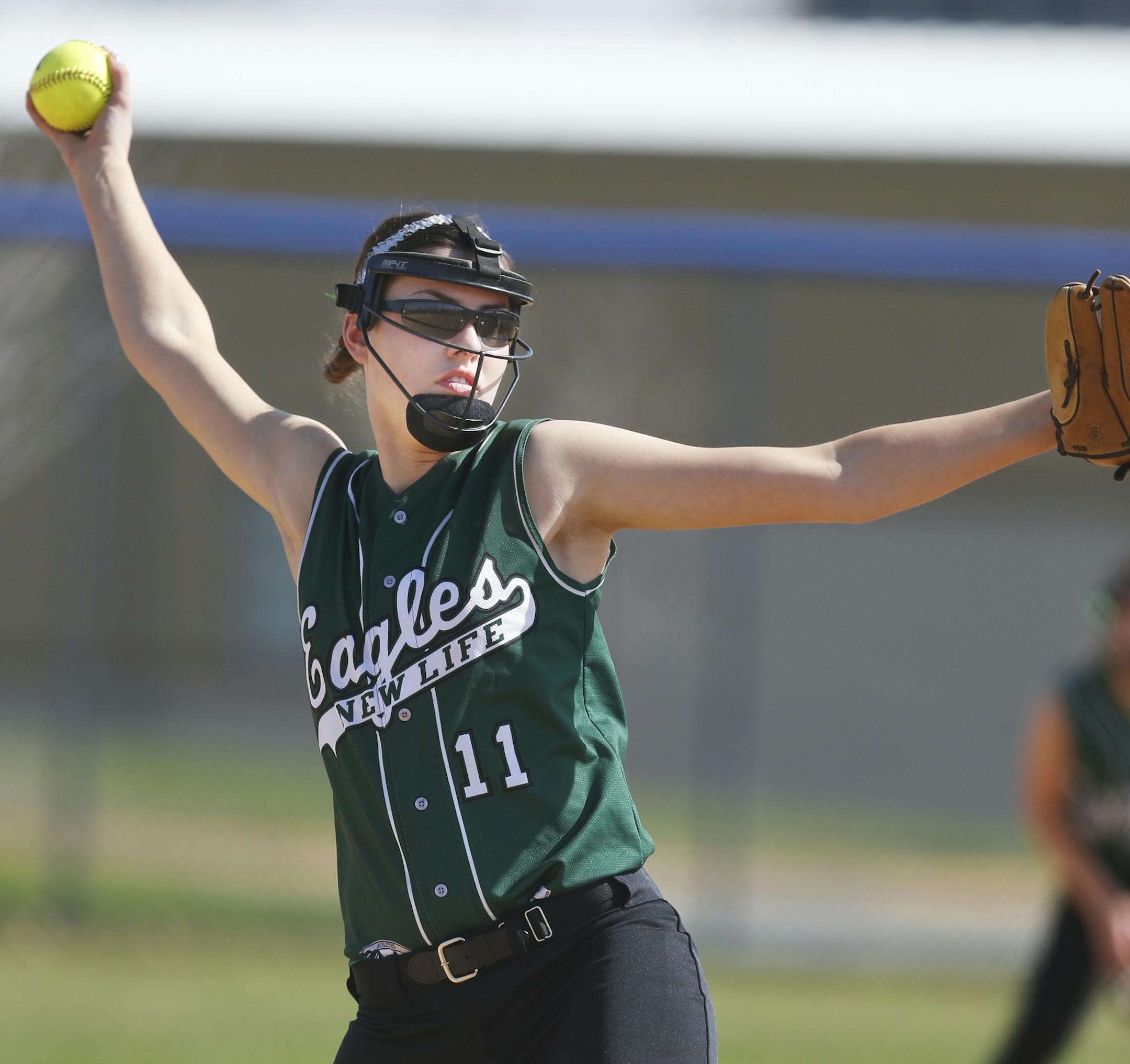 At Bielenberg Sports Complex in Woodbury, New Life Academy Valerie Hohol(11) pitched against Holy Family in a game.]richard.tsong-taatarii/rtsong-taatarii@startribune.com
