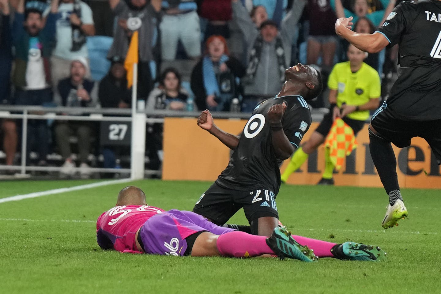 Minnesota United forward Bongokuhle Hlongwane (21) cheered after the tying goal gets past New England Revolution goalkeeper Earl Edwards Jr (36) to tie the game 1-1 in the final seconds of the game Saturday, Sept. 9, 2023 at Allianz Field in St. Paul. ] GLEN STUBBE • glen.stubbe@startribune.com