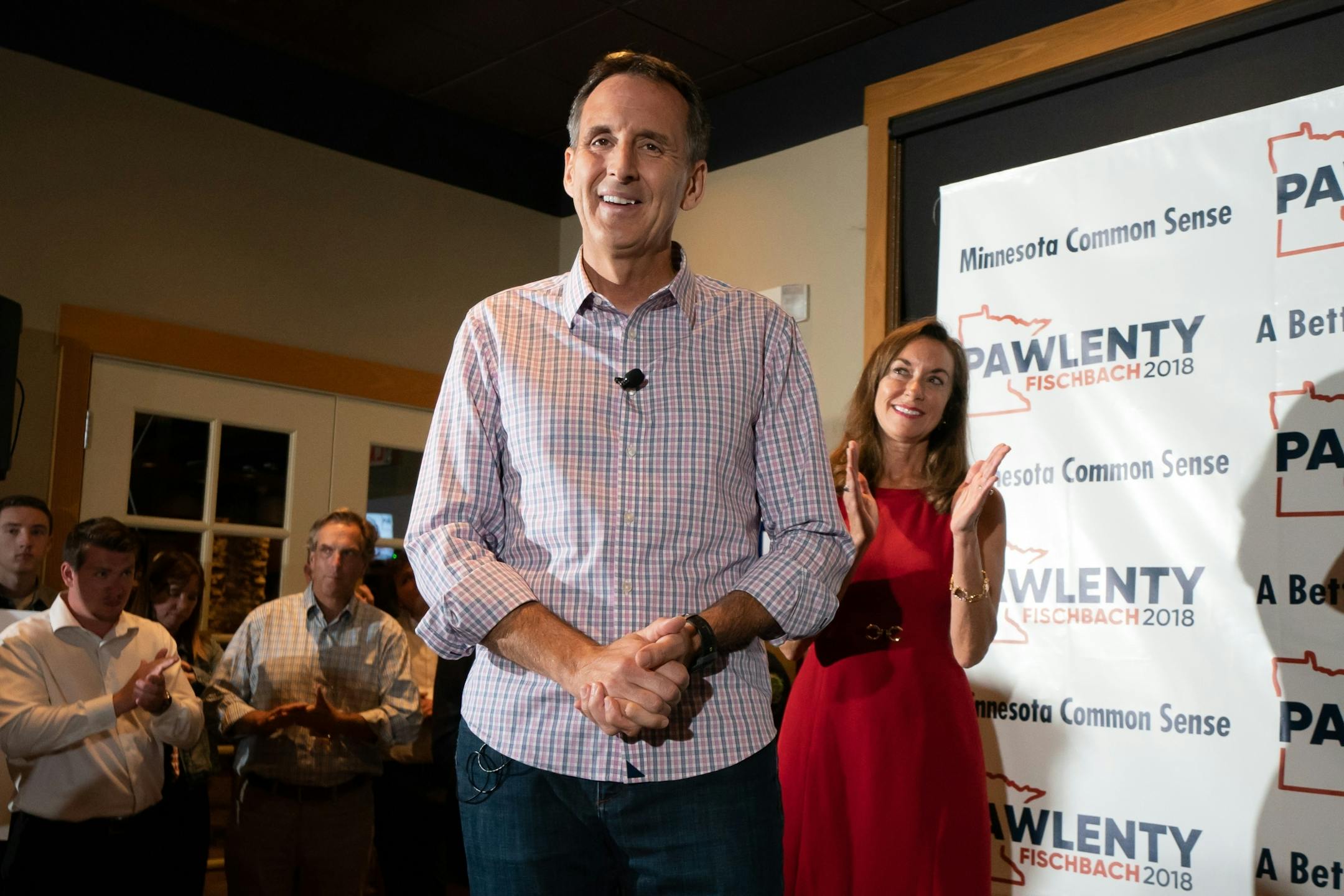 Tim Pawlenty stood with his wife Mary and running mate Michelle Fischbach as he conceded his run for governor at his election night gathering at Granite City Food and Brewery in Eagan.