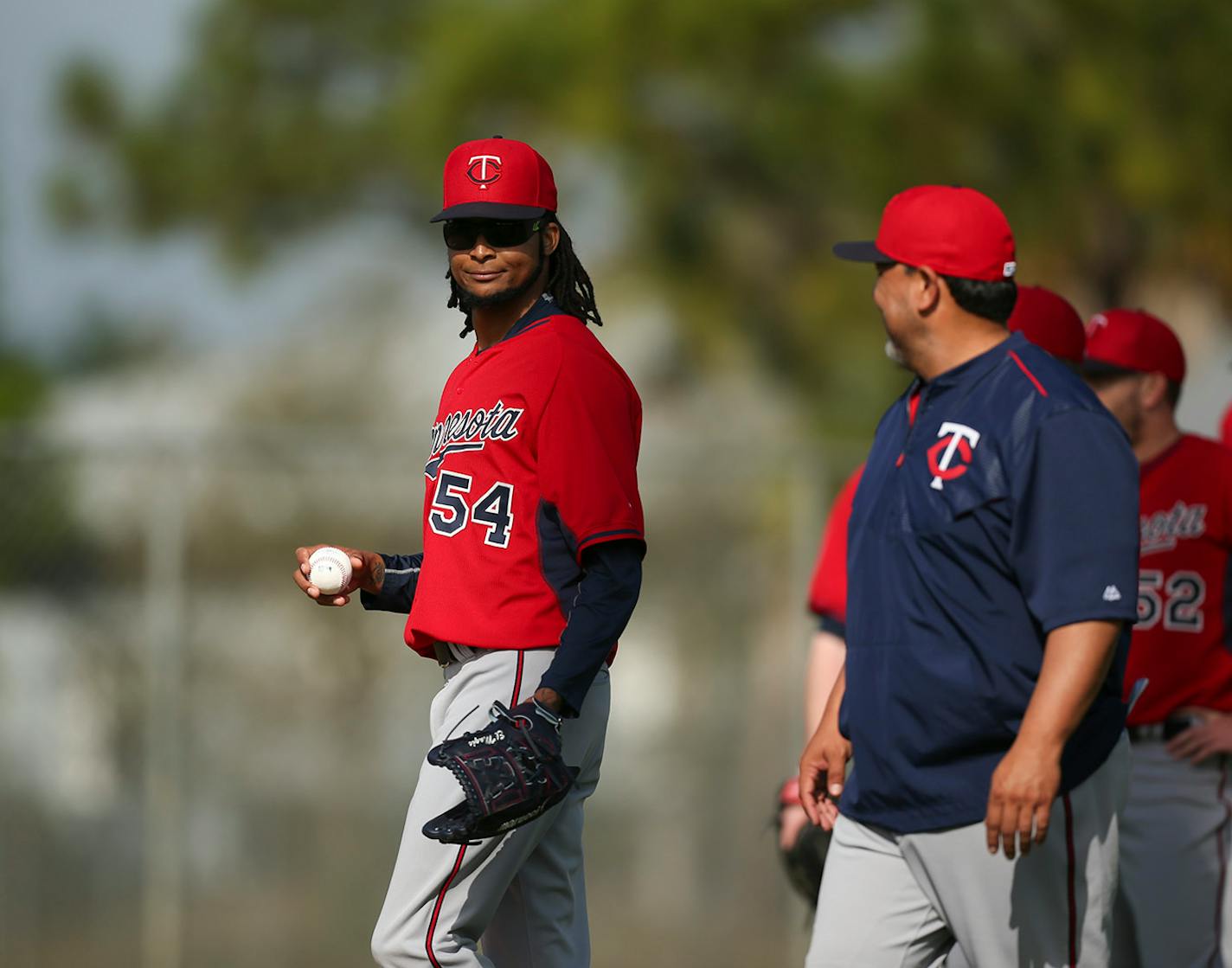 The Twins' Ervin Santana smiled at coach Eddie Guardado before he and some other pitchers started a drill Tuesday morning at Hammond Stadium.