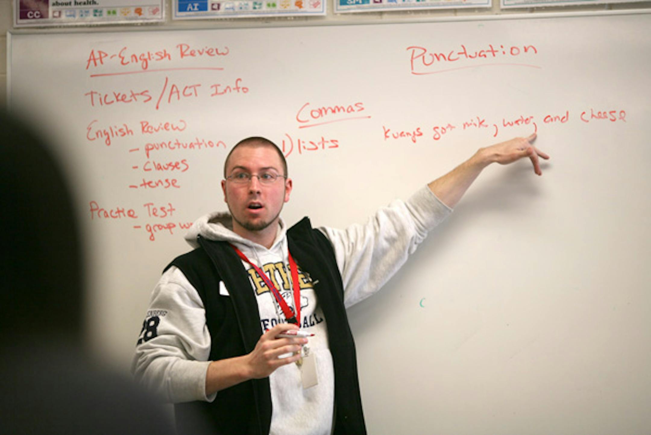 Armstrong Admission Possible program coach Ross Muellenberg reviewed punctuation before the kids in the class took a practice test Monday afternoon.