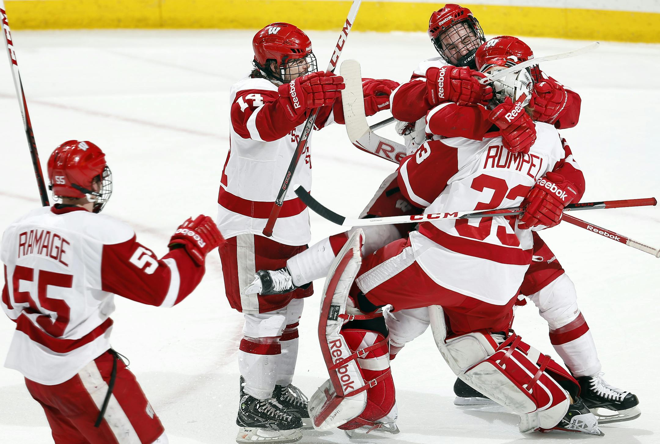 Wisconsin players jumped on goalie Joel Rumpel (33) at the end of the game.Wisconsin beat Colorado College 3-2. ] CARLOS GONZALEZ cgonzalez@startribune.com - March 23, 2013, St. Paul, Minn., Xcel Energy Center, NCAA Hockey, WCHA Final Five, finals, Wisconsin Badgers vs. Colorado College Tigers