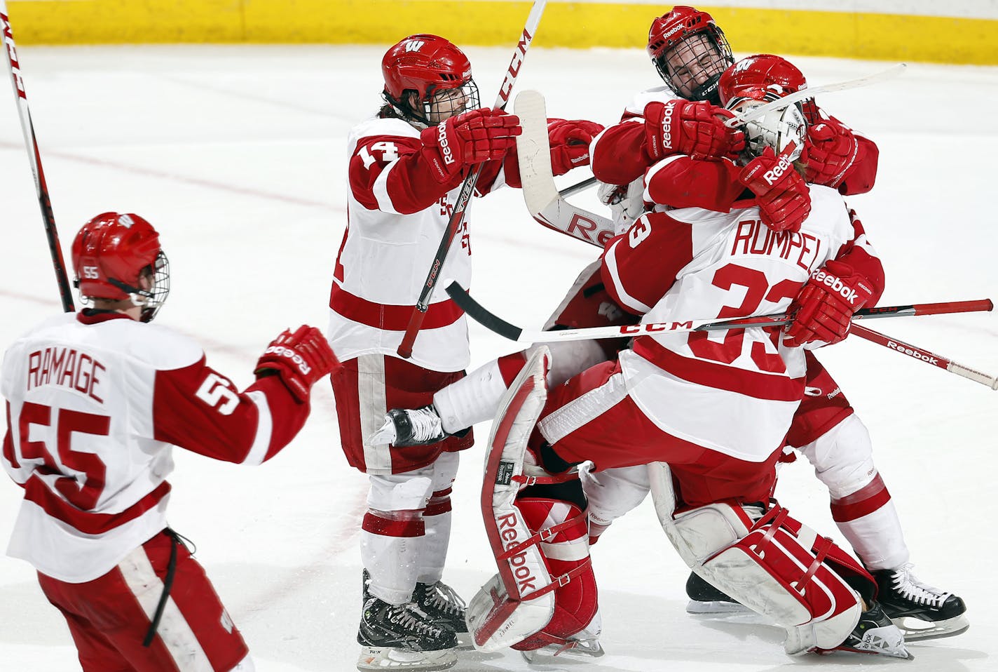 Wisconsin players jumped on goalie Joel Rumpel (33) at the end of the game.Wisconsin beat Colorado College 3-2. ] CARLOS GONZALEZ cgonzalez@startribune.com - March 23, 2013, St. Paul, Minn., Xcel Energy Center, NCAA Hockey, WCHA Final Five, finals, Wisconsin Badgers vs. Colorado College Tigers