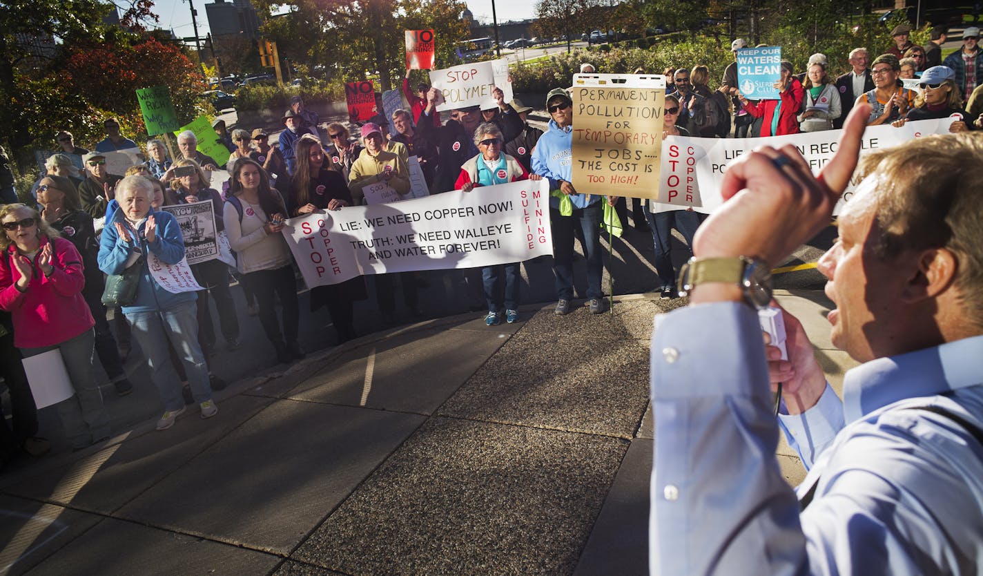 About 150 opponents of PolyMet copper mining gathered in front of the DNR to protest the DNR considering granting a license for the project. Aaron Klemz of Friends of the Boundary Waters Wilderness led the march.