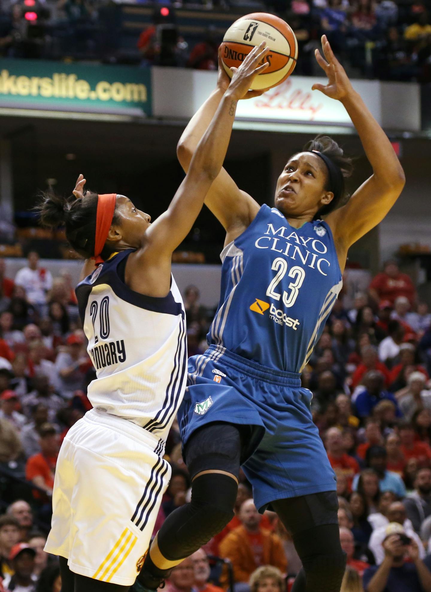 Minnesota Lynx forward Maya Moore (23) shoots against Indiana Fever guard Briann January (20) during the first quarter. ] (KYNDELL HARKNESS/STAR TRIBUNE) kyndell.harkness@startribune.com Game 4 of the WNBA finals Lynx vs Indiana at the Bankers Life Fieldhouse in Indianapolis, Ind., Sunday October 11, 2015.