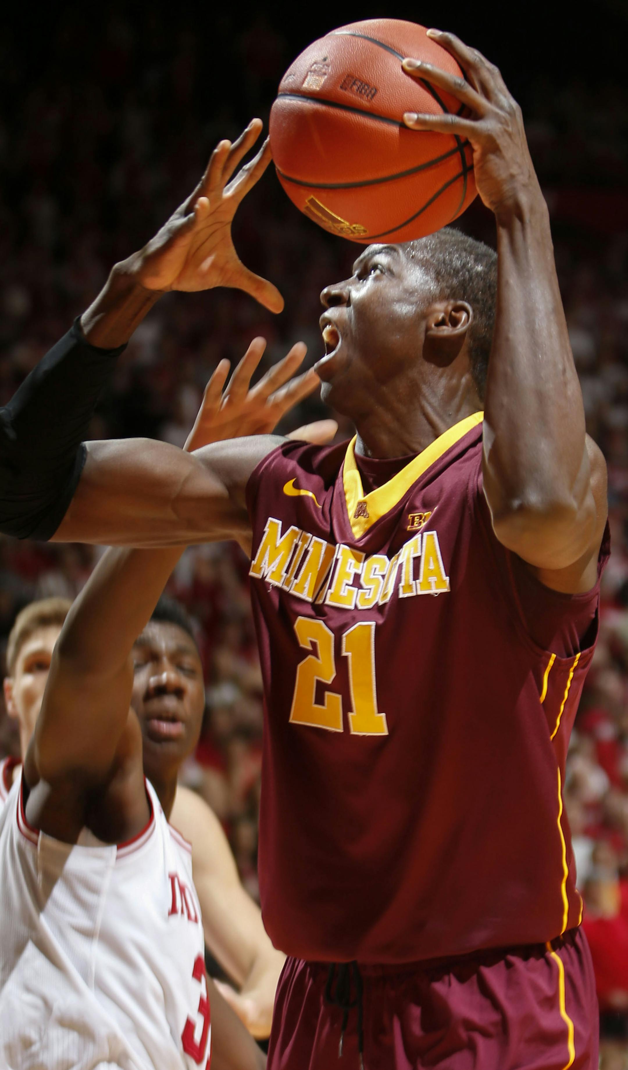 Minnesota center Bakary Konate (21) looks to shoot in front of Indiana center Thomas Bryant in the first half of an NCAA college basketball game in Bloomington, Ind., Saturday, Jan. 30, 2016. (AP Photo/AJ Mast)