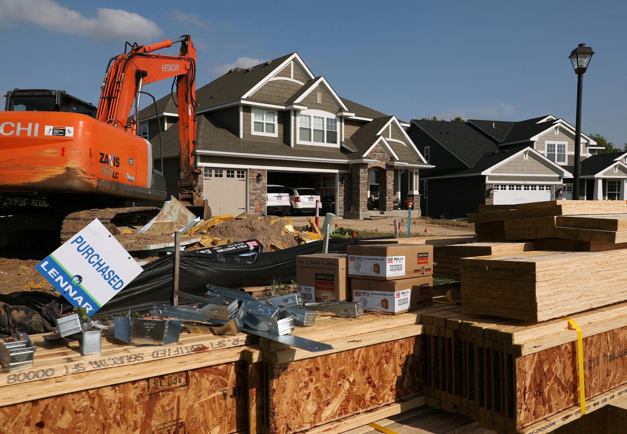 Building materials for a home currently under construction sat near several already inhabited homes in the Settler's Ridge development Wednesday. ] ANTHONY SOUFFLE ï anthony.souffle@startribune.com Construction continued on several homes at the Settler's Ridge development Wednesday, June 6, 2018 in Inver Grove Heights, Minn. With prices of existing houses increasing faster than new homes, homebuilders are hitting their stride. Builders pulled more permits last month to build single-family h
