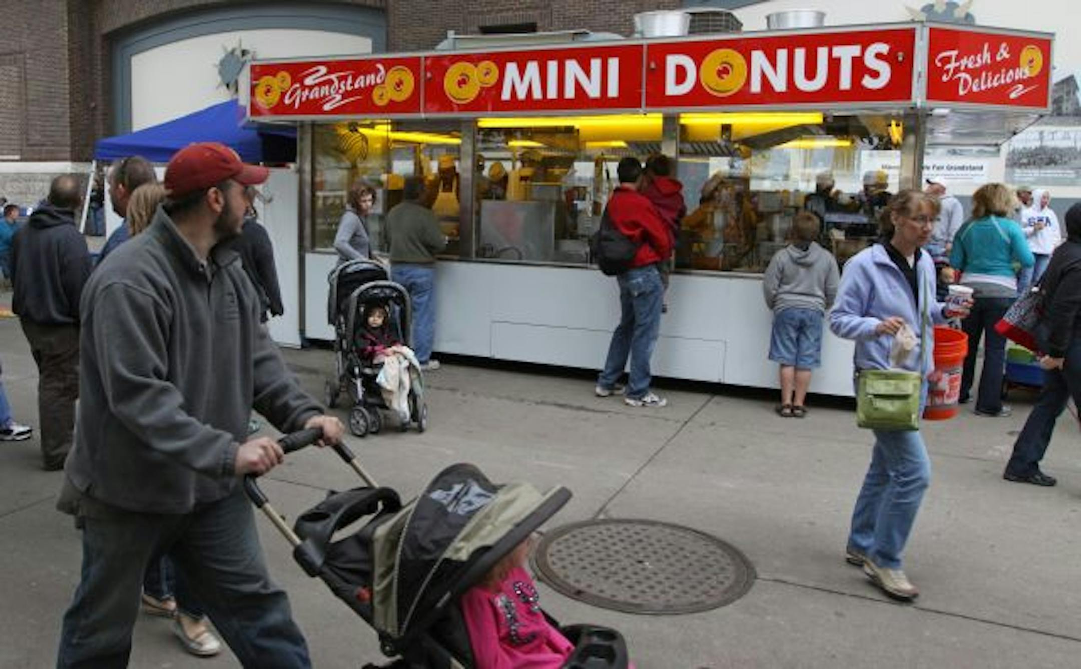 File photo: State Fair goers waited in line the Mini-Donuts booth.