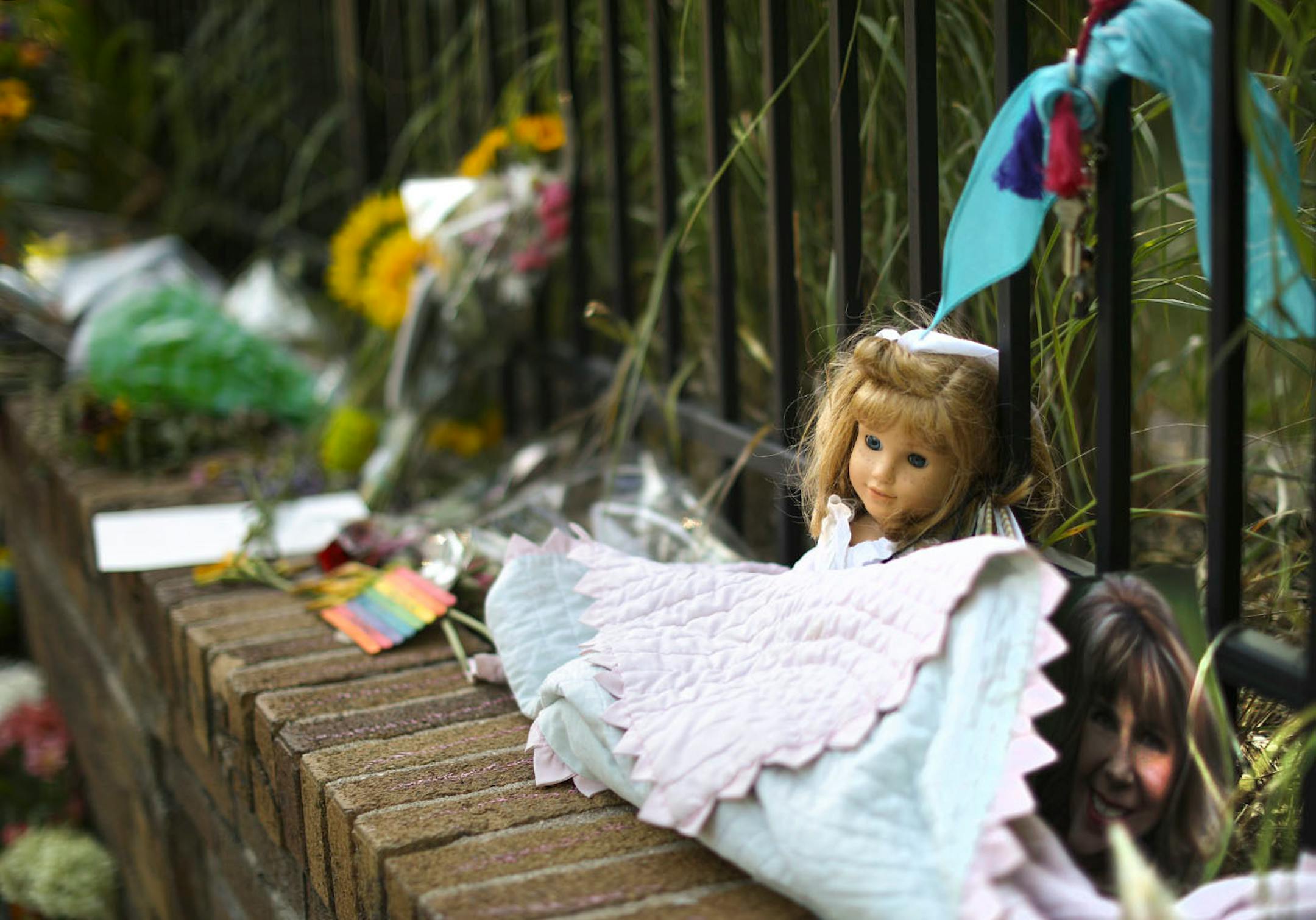 Detail of the larger memorial on the sidewalk on W. 51st. St. in the Fulton neighborhood.