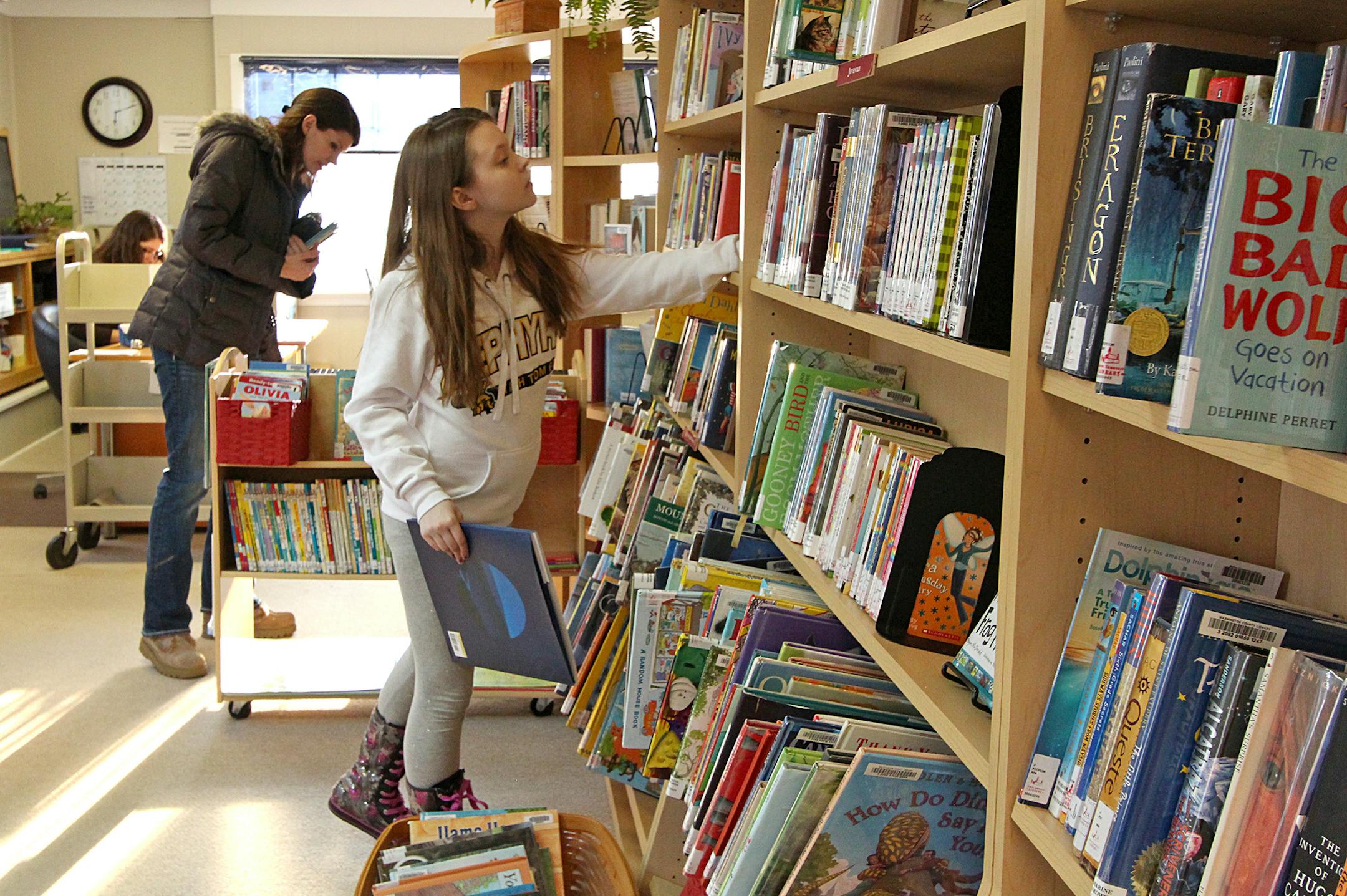 Anneliese Anderson and her mother Deena stopped to browse books at the Marine on St. Croix Community Library. It was their first time visiting the library.