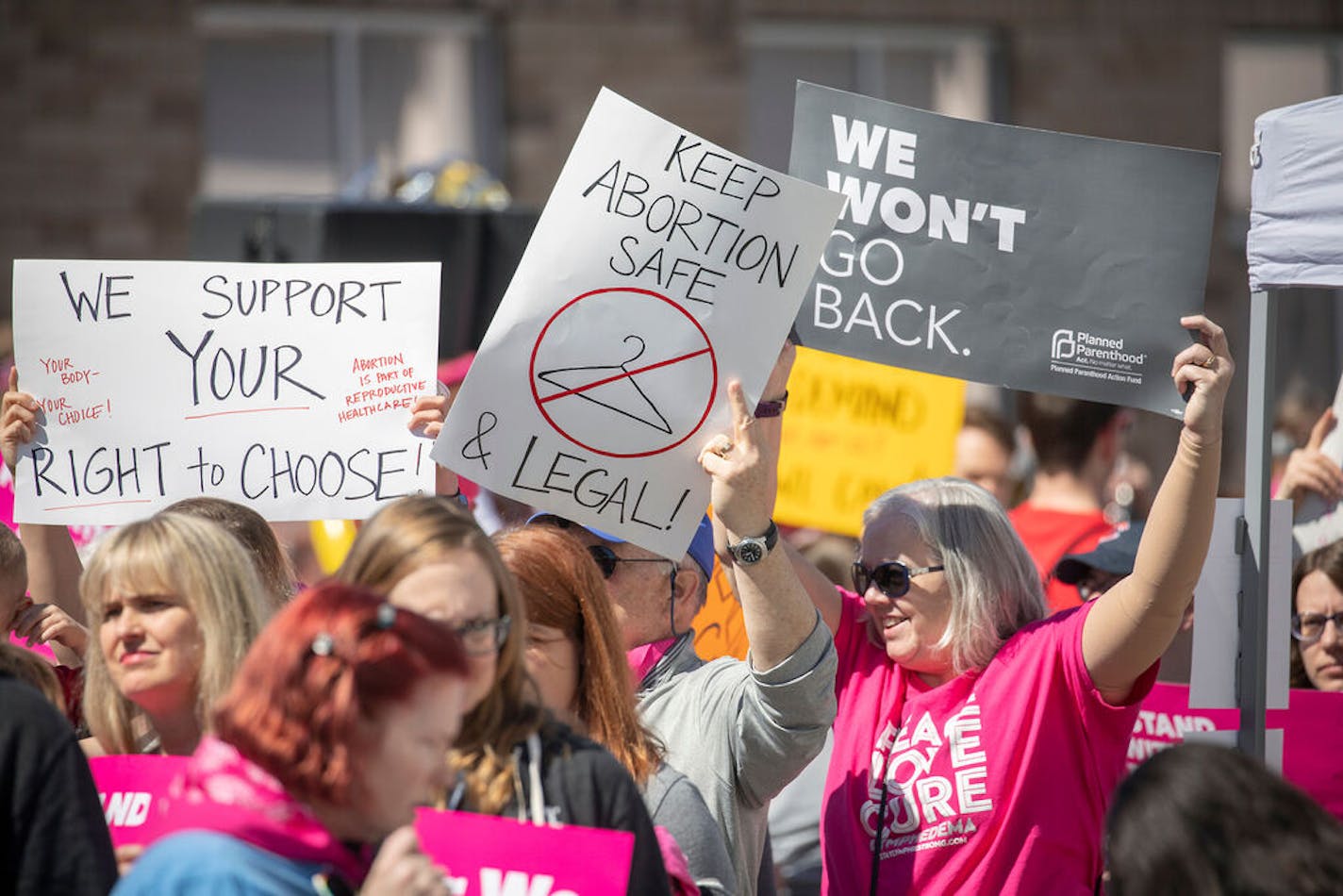 Planned Parenthood supporters gather to rally and "Pledge a Protestor" to raise funds for patients at the Vandalia health center behind the Planned Parenthood building for a peaceful protest, Friday, April 19, 2019 in St. Paul, MN. ] ELIZABETH FLORES • liz.flores@startribune.com