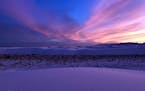 Sunset at White Sands paints the dunes in a striking lavender hue. (Melanie Radzicki McManus/Chicago Tribune/TNS) ORG XMIT: 1528924 ORG XMIT: MIN20010