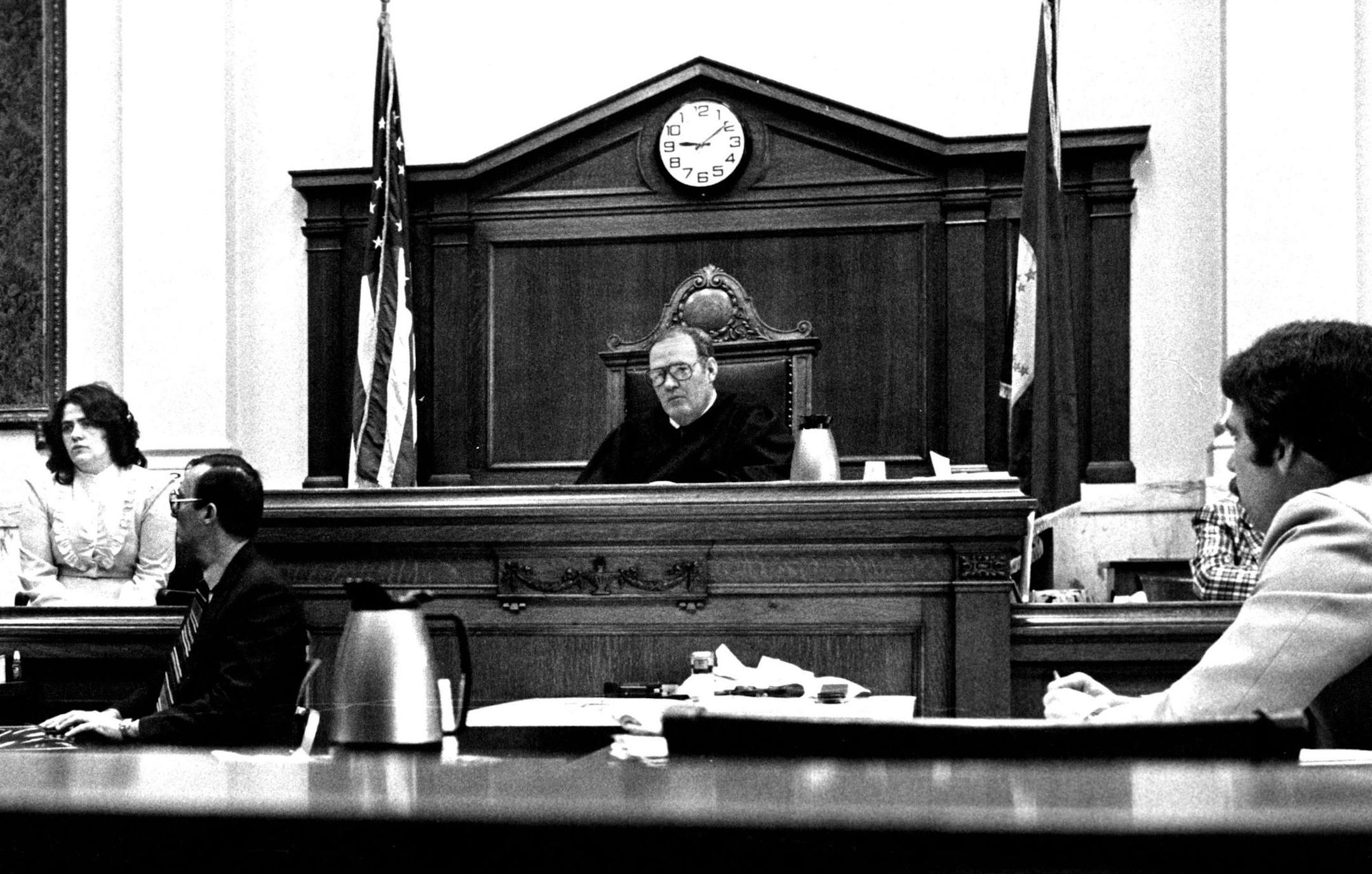 March 13, 1984 Lucile Tisland was on the witness stand last week during her trial in Brainerd, Minn. Others were court reporter Clarence Taatjes, left; County Attorney Tom Keyes, right, and District Judge Clinton Wyant. Art Hager, Minneapolis Star Tribune