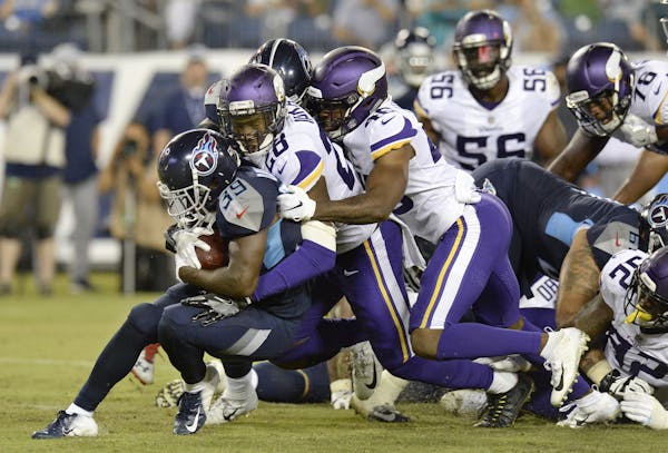 Tennessee Titans running back Dalyn Dawkins (39) is stopped by Minnesota Vikings defensive back George Iloka (28) in the second half of a preseason NF