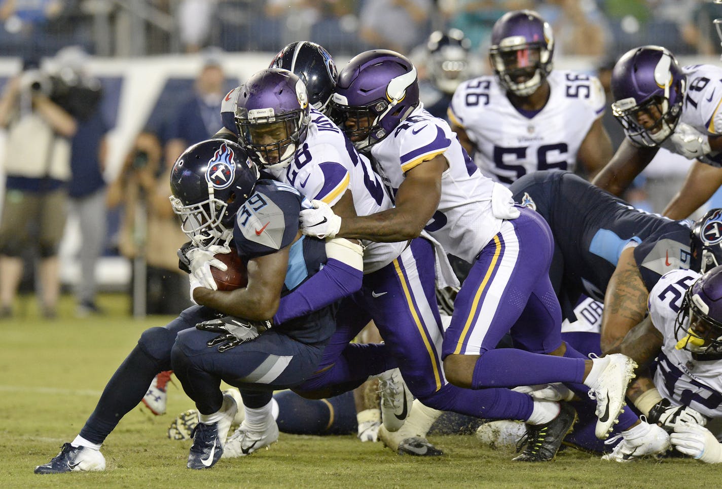 Tennessee Titans running back Dalyn Dawkins (39) is stopped by Minnesota Vikings defensive back George Iloka (28) in the second half of a preseason NFL football game Thursday, Aug. 30, 2018, in Nashville, Tenn. (AP Photo/Mark Zaleski)