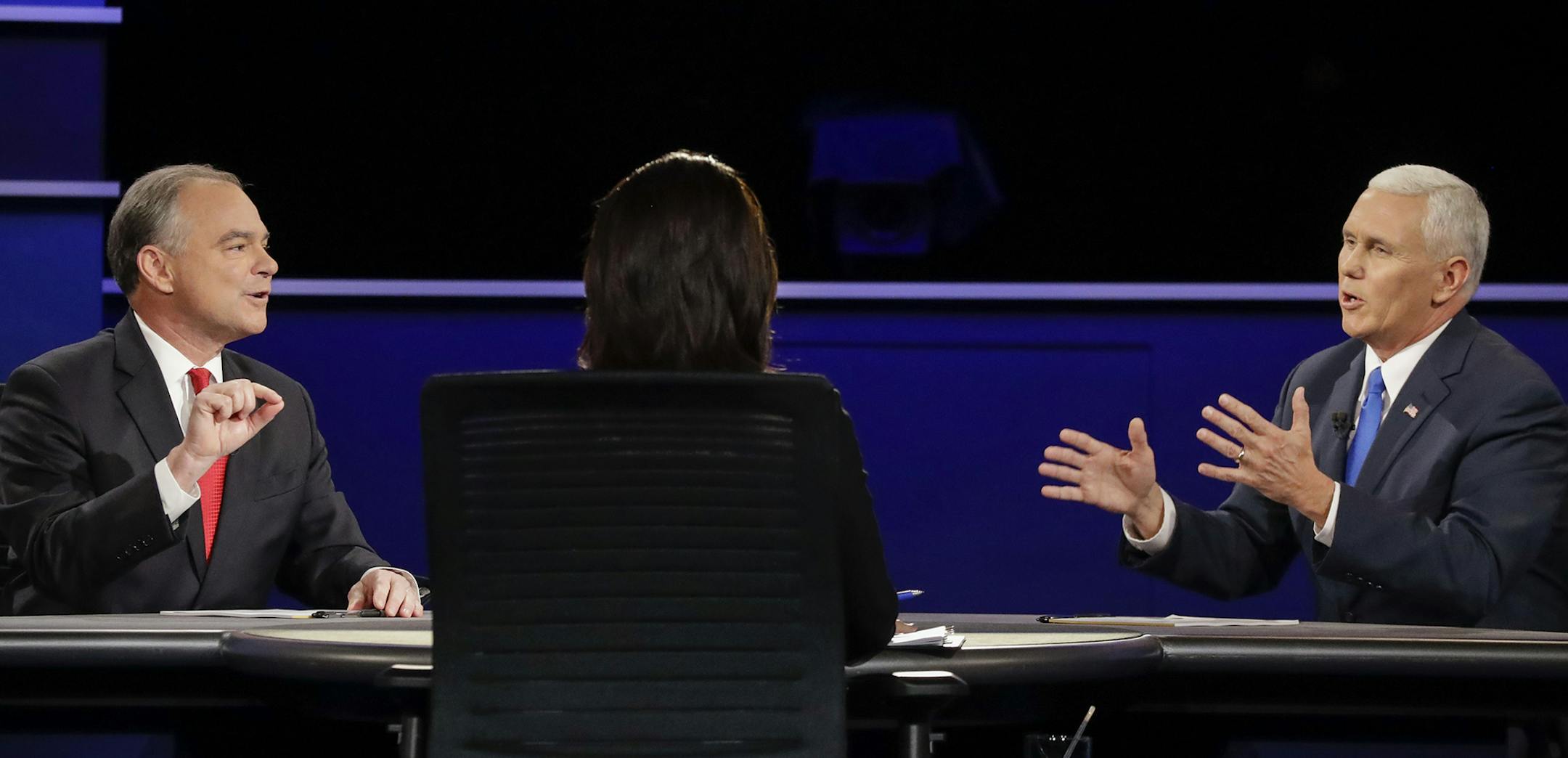 Republican vice-presidential nominee Gov. Mike Pence, and Democratic vice-presidential nominee Sen. Tim Kaine discuss a question during the vice-presidential debate at Longwood University in Farmville, Va., Tuesday, Oct. 4, 2016. (AP Photo/David Goldman) ORG XMIT: MIN2016100511573944