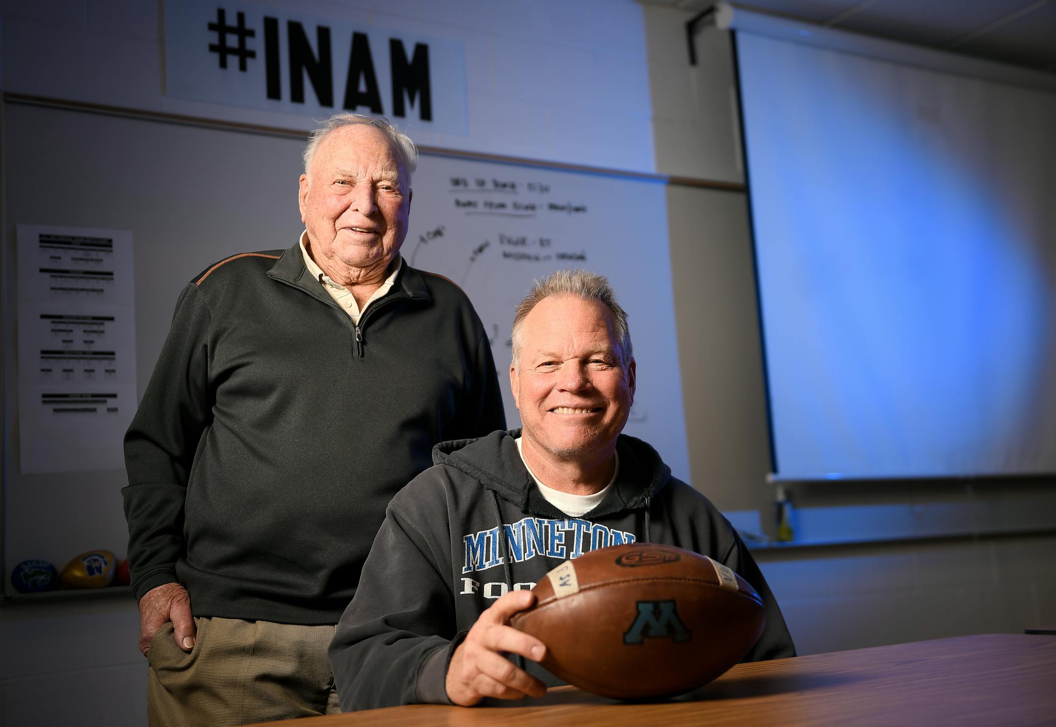 Minnetonka football head coach Dave Nelson, right, sat beside his father, former coach Stan Nelson
