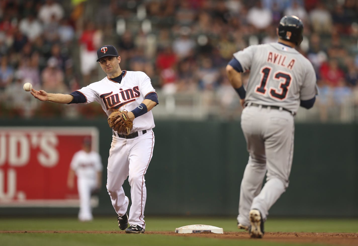 Minnesota Twins second baseman Brian Dozier threw to first to complete a second inning double play after forcingthe Detroit Tigers' Alex Avila out at second Thursday night at Target Field. JEFF WHEELER &#xef; jeff.wheeler@startribune.com The Twins began a series with the Detroit Tigers Thursday night, July 9, 2015 at Target Field in Minneapolis.