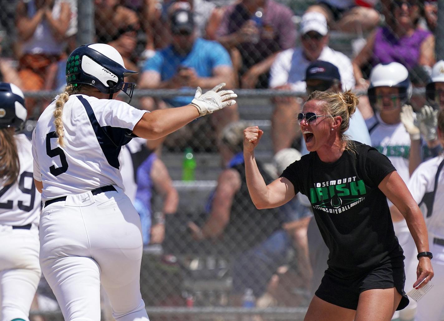 Rosemount's Paige Zender, 5 celebrated with head coach Tiffany Rose as she rounded third after hitting a grand slam in the fifth inning of the Class 4A championship game against Forest Lake last week.