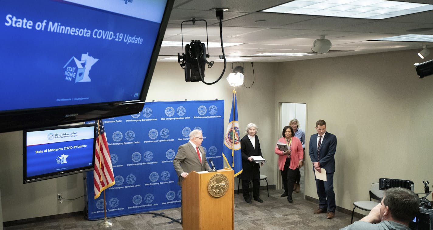 In a tightly pooled press conference, Minnesota Gov. Tim Walz provides an update on the state's next steps to respond to COVID-19 during a news conference on Wednesday, April 8, 2020 in St. Paul, Minn. Walz is extending Minnesota&#x2019;s stay-at-home order until May 4 as the number of COVID-19 deaths in the state continues to rise. The original order was scheduled to end Friday. Walz said Wednesday that the order has bought Minnesota needed time to slow the spread of the coronavirus but must co