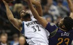 Timberwolves center Karl-Anthony Towns was fouled by Pelicans forward Anthony Davis as he shot in the in the third quarter. Towns led the Wolves with 