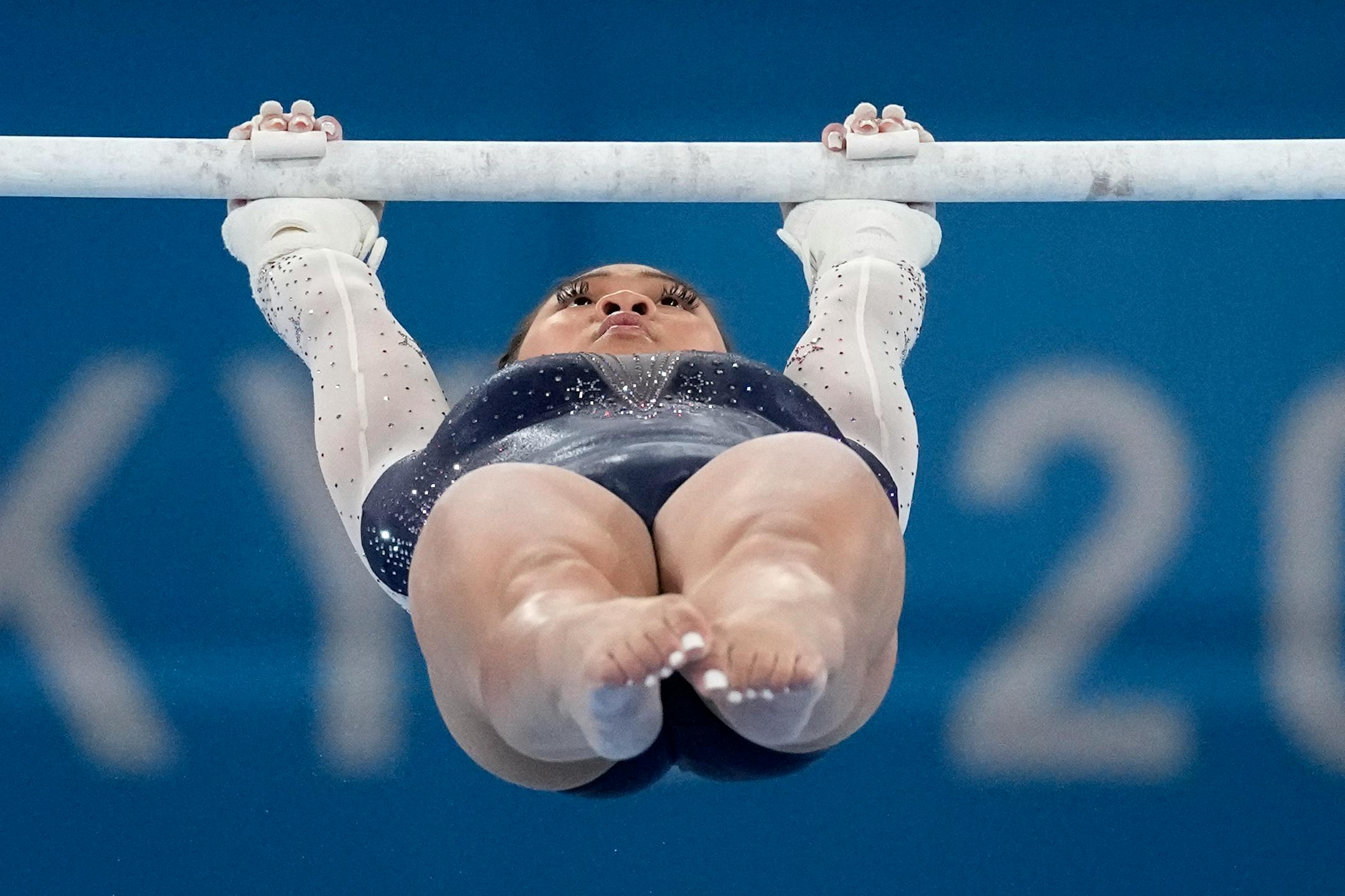 Suni Lee, of the United States, performs on the uneven bars during the artistic gymnastics women's all-around final at the 2020 Summer Olympics, Thursday, July 29, 2021, in Tokyo. (AP Photo/Ashley Landis)