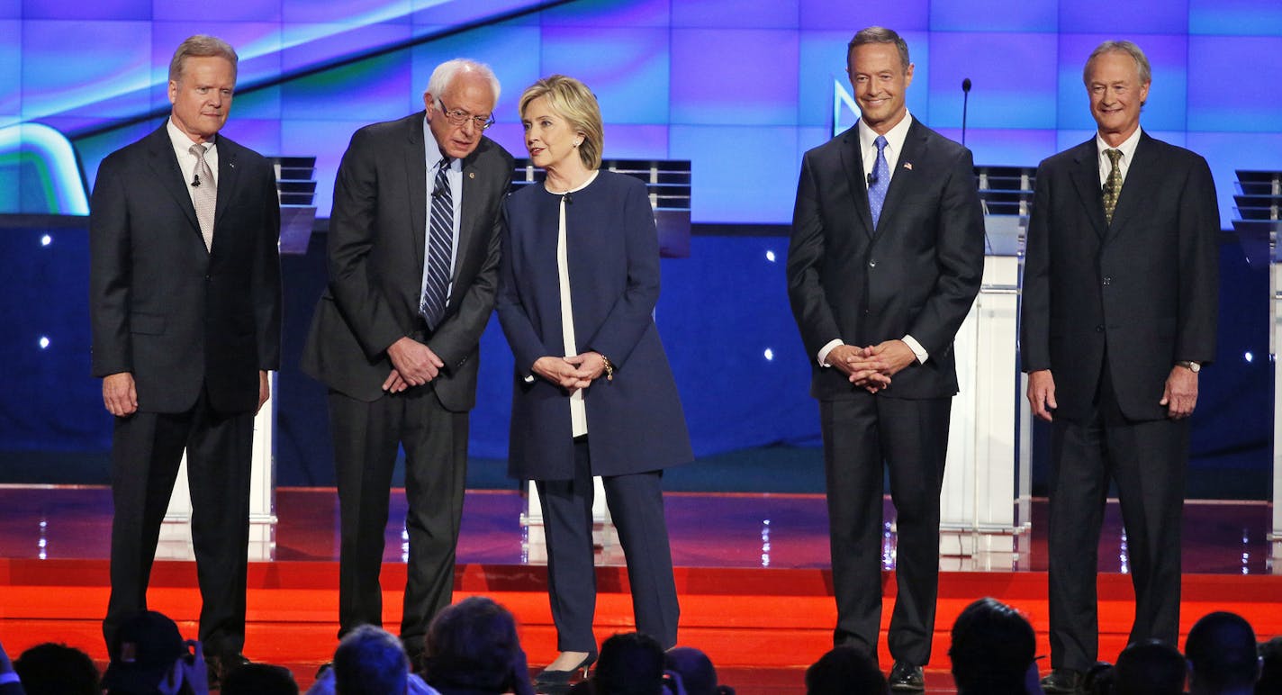 Democratic presidential candidates from left, former Virginia Sen. Jim Webb, Sen. Bernie Sanders, of Vermont, Hillary Rodham Clinton, former Maryland Gov. Martin O'Malley, and former Rhode Island Gov. Lincoln Chafee take the stage before the CNN Democratic presidential debate Tuesday, Oct. 13, 2015, in Las Vegas. (AP Photo/John Locher)