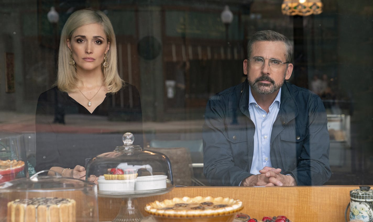 In this image released by Focus Features, Steve Carell, right, and Rose Byrne appear in a scene from "Irresistible." (Daniel McFadden/Focus Features via AP)