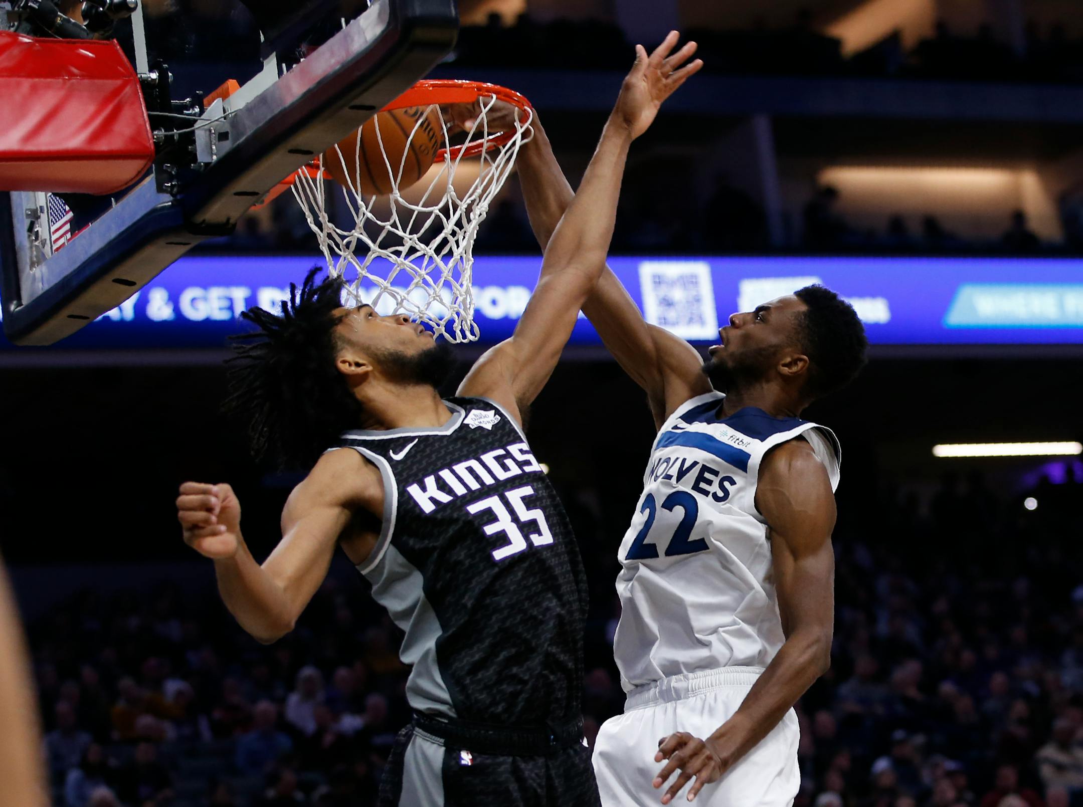 Wolves forward Andrew Wiggins duned over Kings forward Marvin Bagley III during the first quarter Thursday,