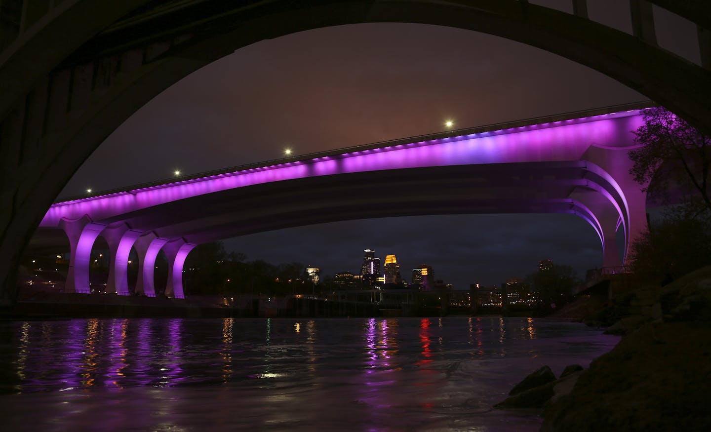 The I-35W bridge was bathed in purple Thursday night in a memorial to Prince. ] JEFF WHEELER &#xef; jeff.wheeler@startribune.com Downtown Minneapolis buildings were bathed in purple light, including the I-35W bridge, foreground, in a memorial to Prince Thursday, April 21, 2016.