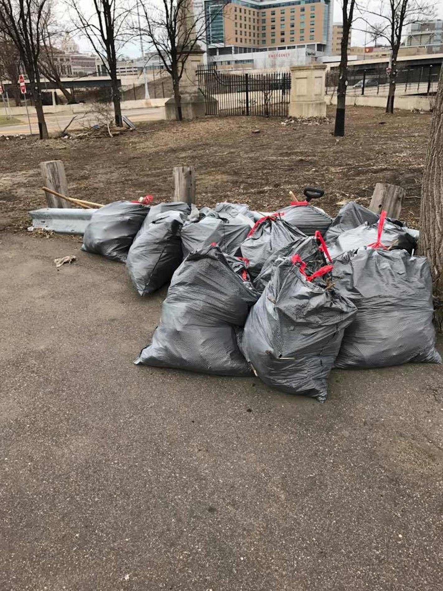 Volunteers, who were frustrated by a lack of government action, cleaned up dozens of bags of trash at 10th and Wacouta streets on the edge of downtown St. Paul. ORG XMIT: Z60q8-B9OTSNs-VcOTUX