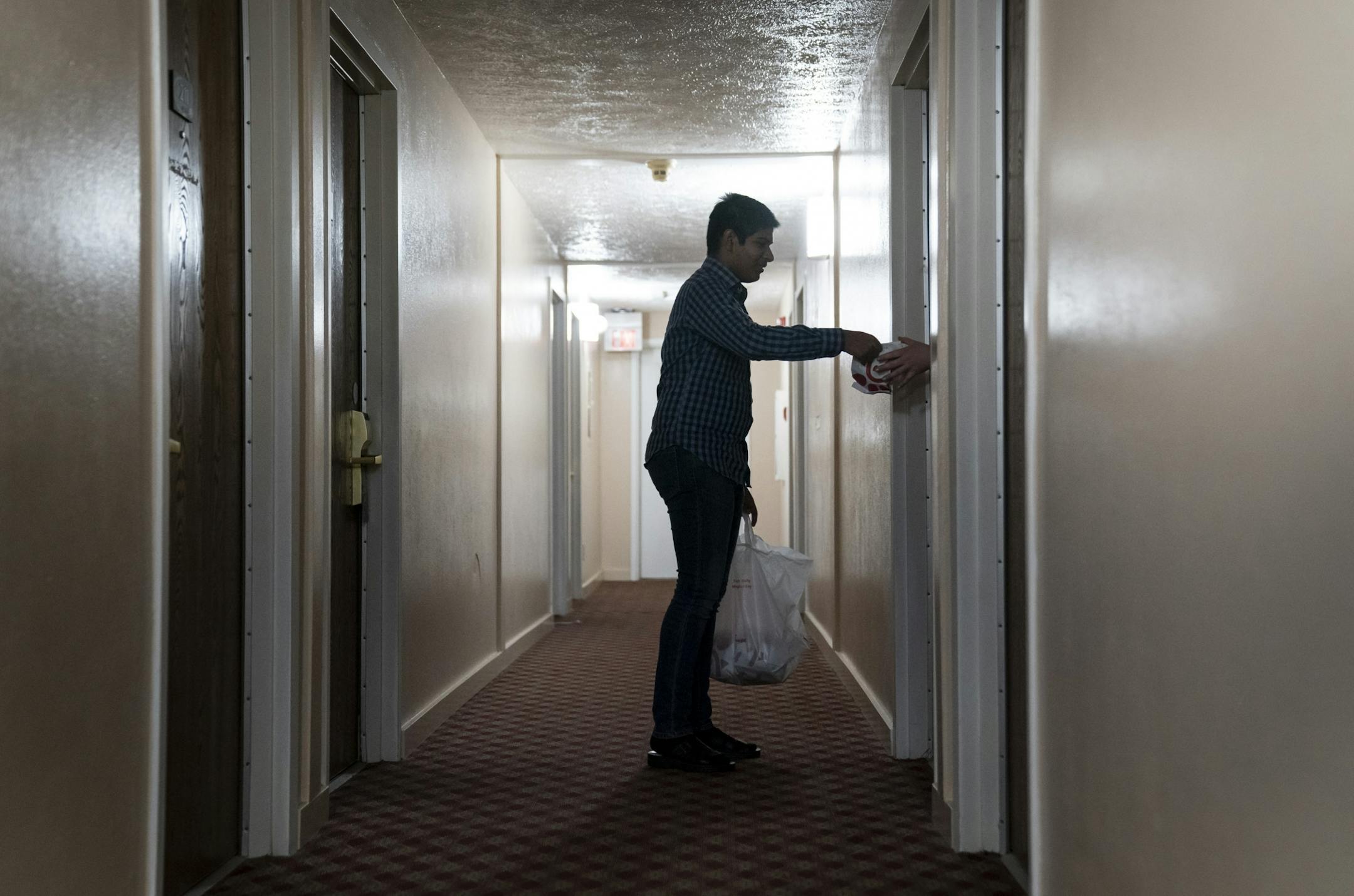 Zahid Memood dropped off Chick-fil-A for homeless people residing at the Chaska Super 8. He was helping out his sister Sana Cheema who is the general manager of the hotel in Chaska, Minn., on Friday, May 15, 2020.