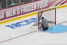 A goal is fixed in place during practice Wednesday in anticipation of the start of the Frozen Four.