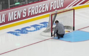 A goal is fixed in place during practice Wednesday in anticipation of the start of the Frozen Four.