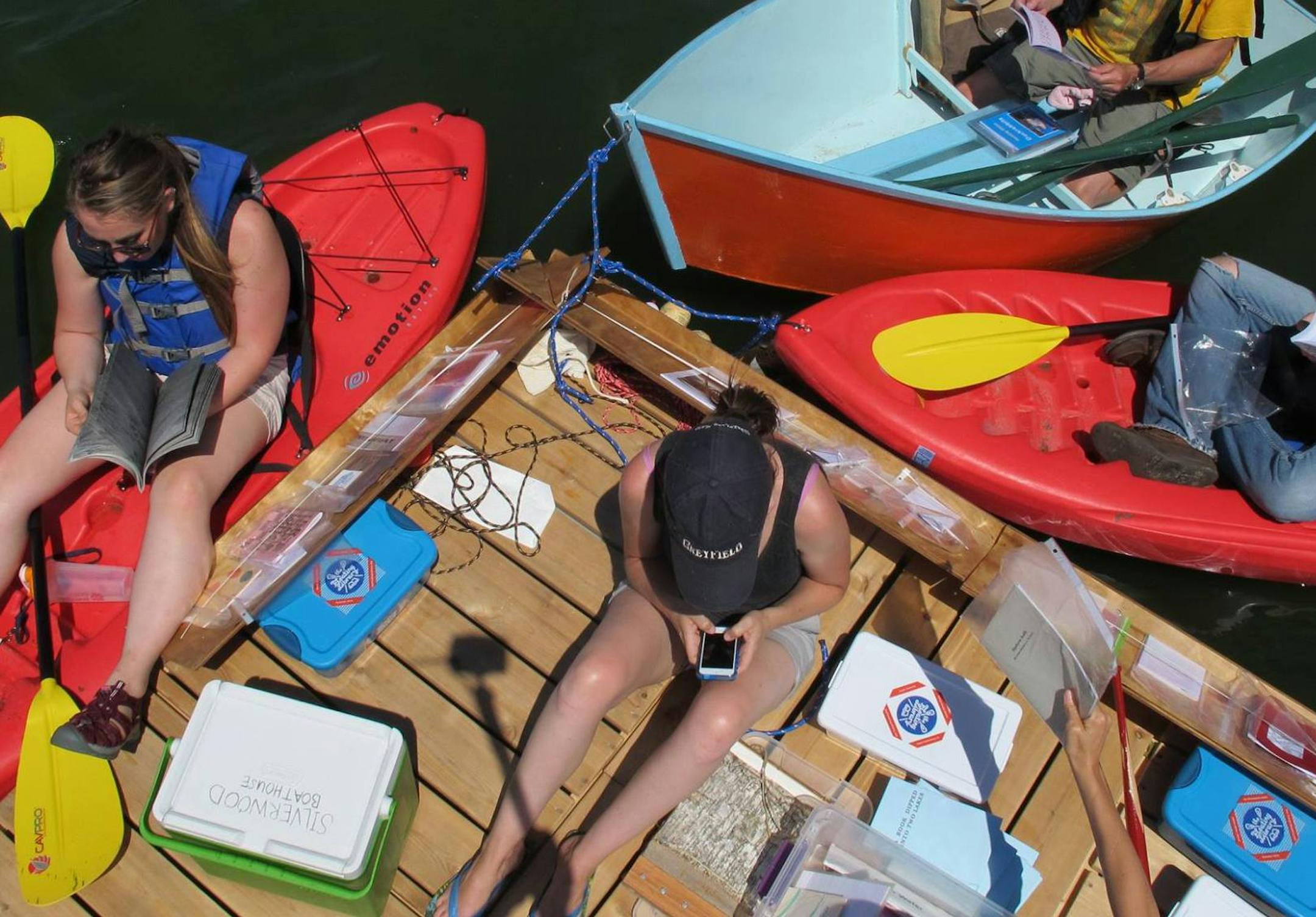Readers patronize the Floating Library. Photo by David Eberhardt.