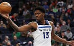 Minnesota Timberwolves forward Nathan Knight (13) handles the ball during the second half of an NBA basketball game against the Boston Celtics, Monday