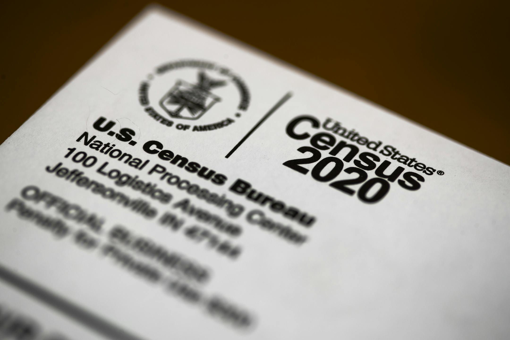 FILE - This March 19, 2020 file photo shows an envelope containing a 2020 census letter mailed to a U.S. resident, in Glenside, Pa. Three metro areas in in Texas had some of the biggest population gains over the past decade, according to figures released Thursday, March 26 by the U.S. Census Bureau. Dallas increased by 1.2 million people, the most of any U.S. metro area, followed by Houston, which added another 1.1 million residents over the decade. Austin grew by more than a half million reside