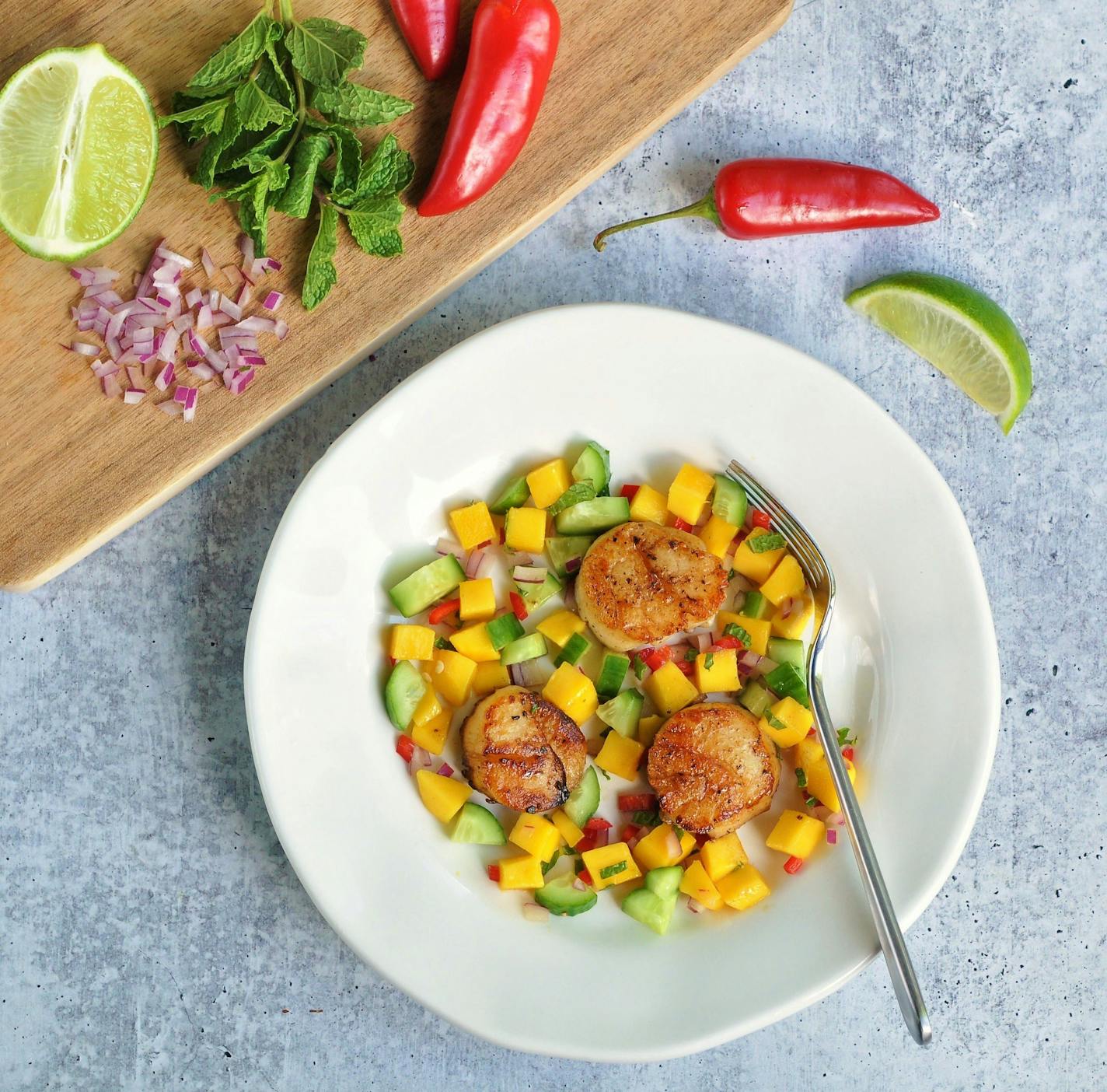 Pan-Seared Scallops with Mango Cucumber Salsa. Meredith Deeds photo