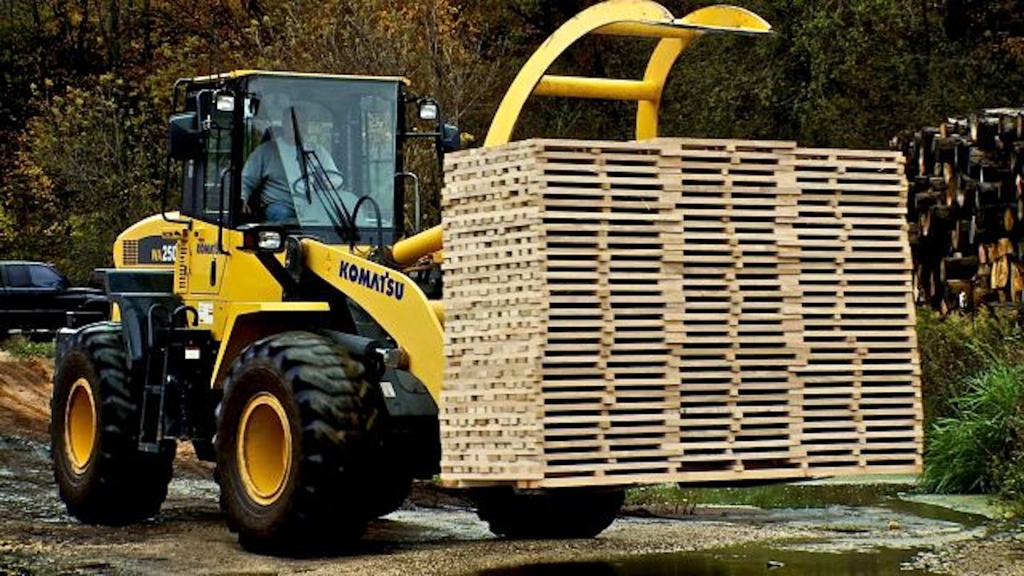 A stack of cut and sorted white oak staves is moved from the production facility to be stored and shipped to wine barrel makers.