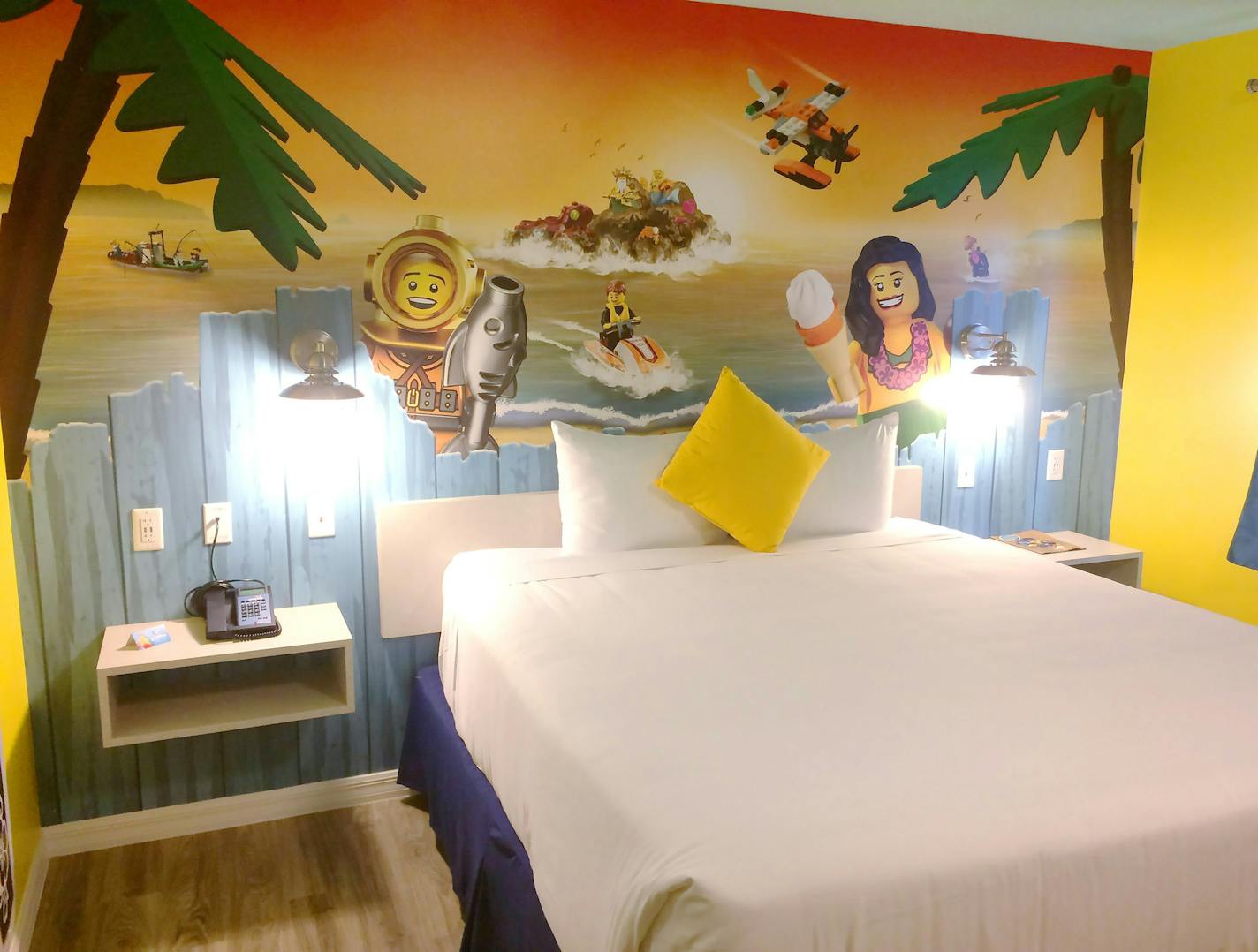 The interior of a bungalow room at Legoland Beach Retreat features wallpaper images of Lego Minifigs.(Rob Owen/Pittsburgh Post-Gazette/TNS)