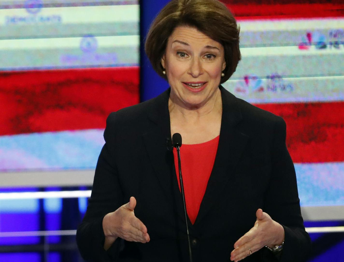 Democratic presidential candidate Sen. Amy Klobuchar, D-Minn., speaks at a Democratic primary debate hosted by NBC News at the Adrienne Arsht Center for the Performing Art, Wednesday, June 26, 2019, in Miami, as former Texas Rep. Beto O'Rourke listens. (AP Photo/Wilfredo Lee)