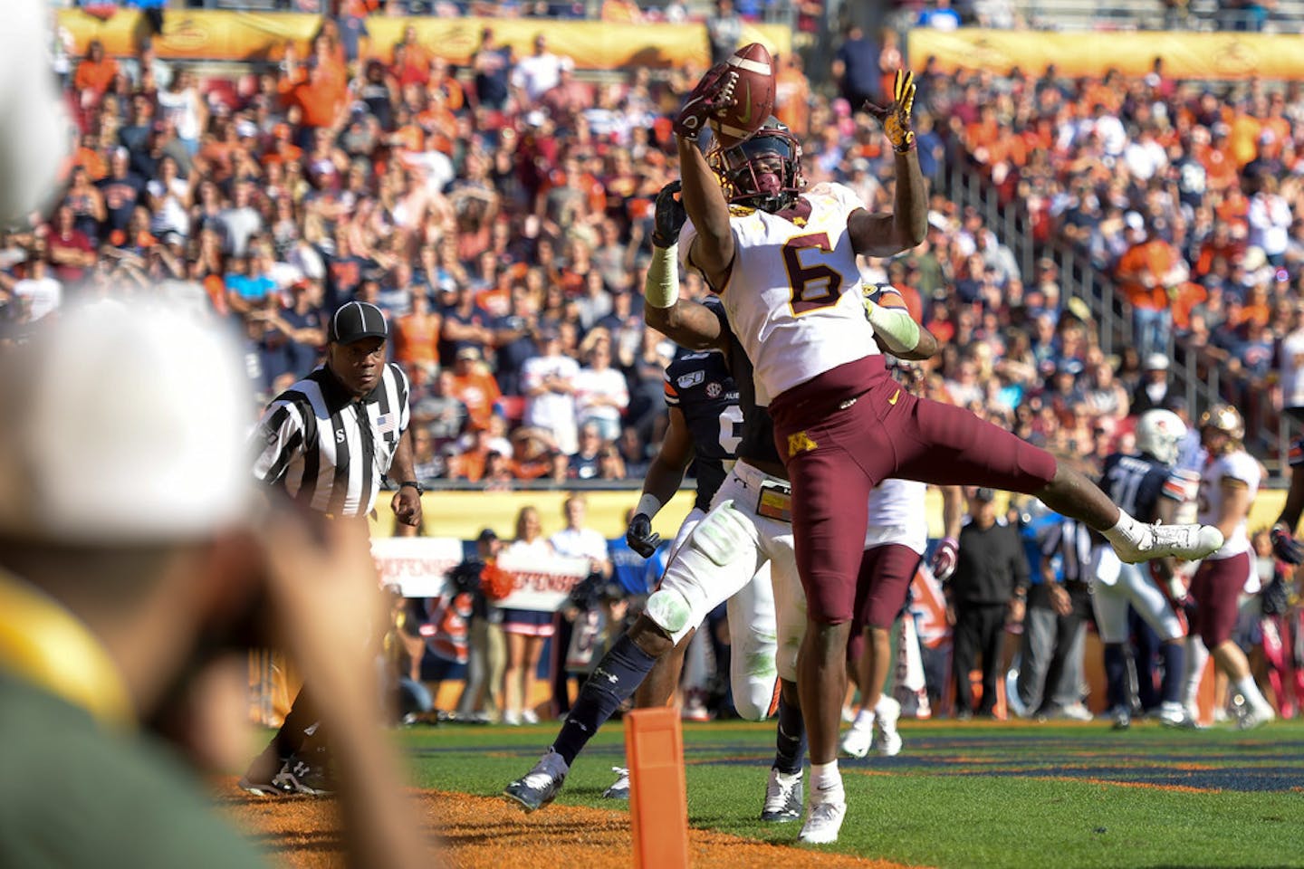 Gophers wide receiver Tyler Johnson's hands and feet were in perfect unison on an acrobatic 2-yard touchdown grab late in the first half of Wednesday's 31-24 victory over Auburn in the Outback Bowl in Tampa, Fla.