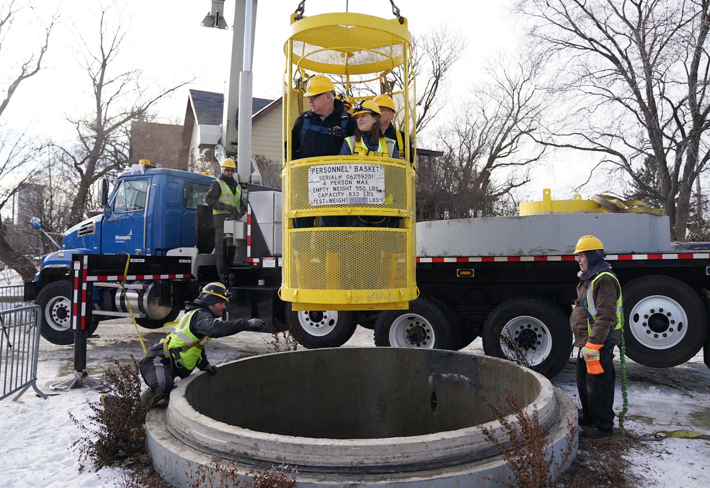 Gov. Tim Walz, commissioner of Minnesota Management and Budget Myron Frans, Minneapolis director of Public Works Robin Hutcheson, sewer engineer Joe Klejwa rode in a personnel basket back to the surface following an underground tour of the storm tunnel system in northeast Minneapolis Friday. ] ANTHONY SOUFFLE &#x2022; anthony.souffle@startribune.com Gov. Tim Walz and Myron Frans, commissioner of Minnesota Management and Budget, toured a municipal storm tunnel after he unveiled the second piece o