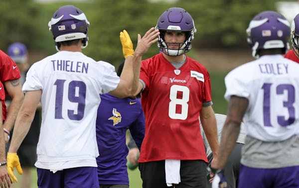 Vikings new starting QB Kirk Cousins gave Adam Thielen the back-handed-high-five during practice at their new Eagan facility.
BRIAN PETERSON &#x2022; 