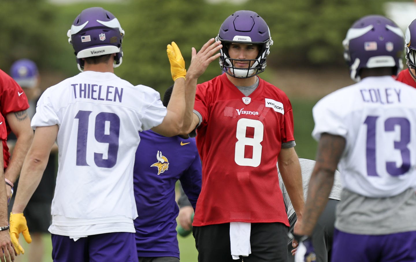 Vikings new starting QB Kirk Cousins gave Adam Thielen the back-handed-high-five during practice at their new Eagan facility.
BRIAN PETERSON &#x2022; brian.peterson@startribune.com
Eagan, MN 05/23/2018