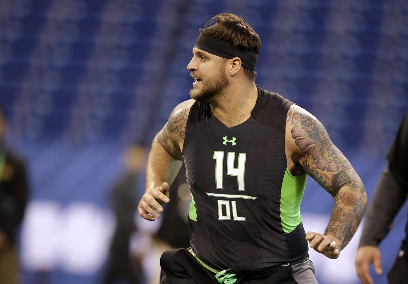 Ohio State offensive lineman Taylor Decker runs a drill at the NFL football scouting combine in Friday, Feb. 26, 2016, in Indianapolis. (AP Photo/Darron Cummings)