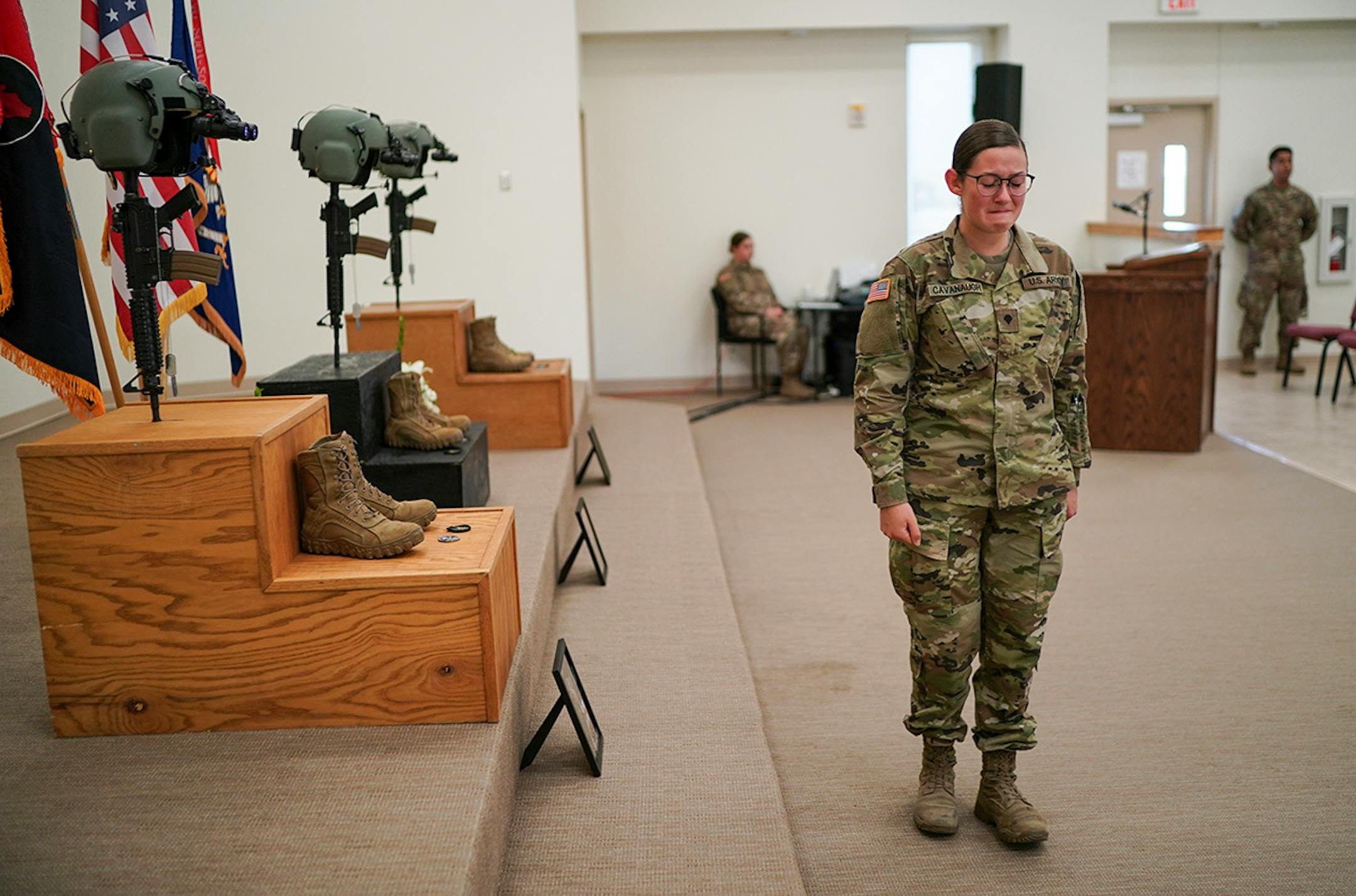 Spc. Nicole Cavanaugh fought back tears as she turned to walk away after paying tribute to the memorials of the three soldiers who died during a training exercise in Minnesota last week.