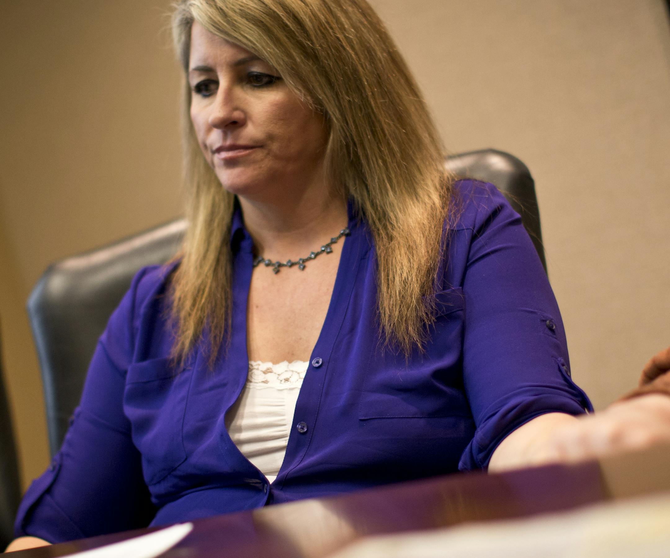 Hilary Kost talked about how her information had been accessed by law enforcement multiple times after she was in the Pioneer Press and Fox 9 news, while at her lawyer's office on Monday, March 11, 2013 in Edina, Minn. Kost and her lawyer Marshall Tanick filing suit after Kost's information was viewed more than 100 times since 2000. ] (RENEE JONES SCHNEIDER * reneejones@startribune.com)